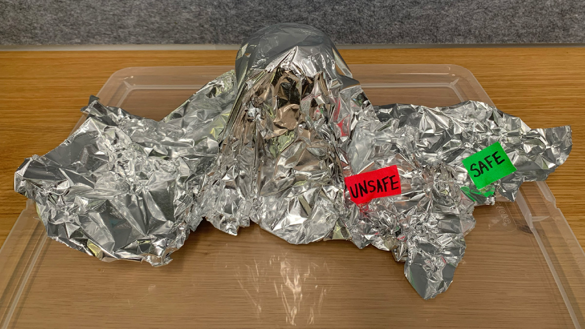 Photo of a model of a volcano made from aluminum and the safe and unsafe zones labeled