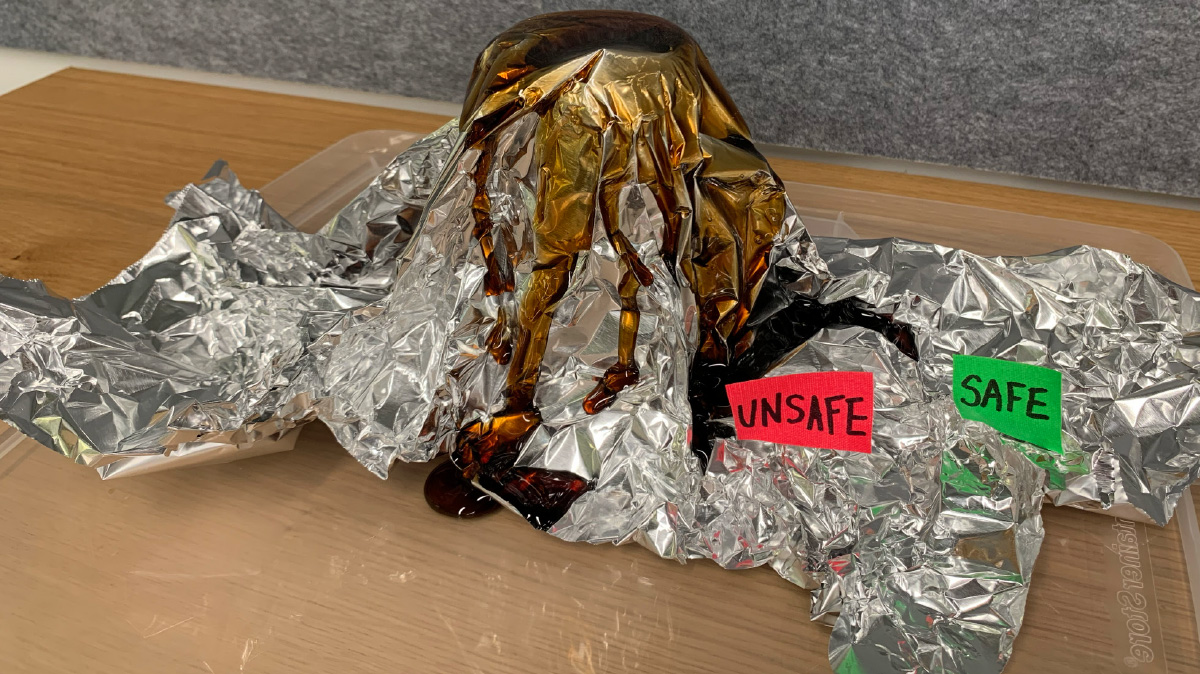 Photo of a model of a volcano made from aluminum and the safe and unsafe zones labeled