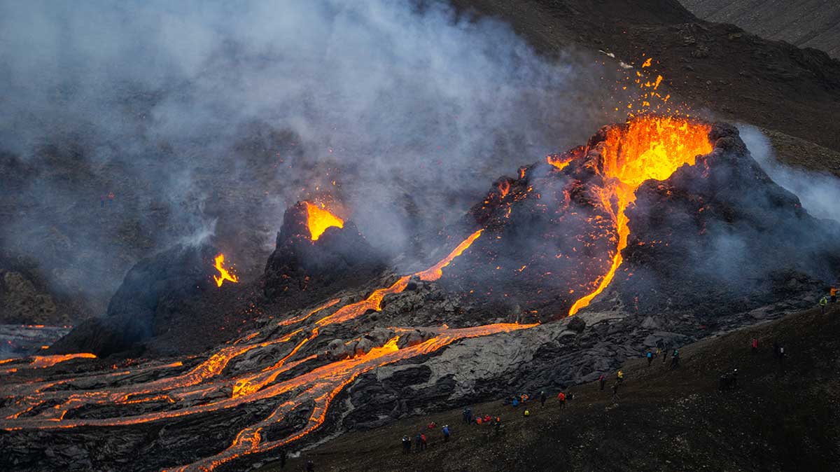 Photo of a volcano erupting lava