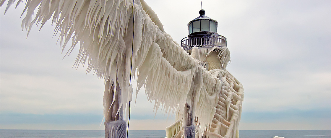 Image of a lighthouse layered with ice